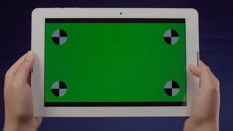 Woman using a tablet with green screen – Chroma Key 動画素材 129178222