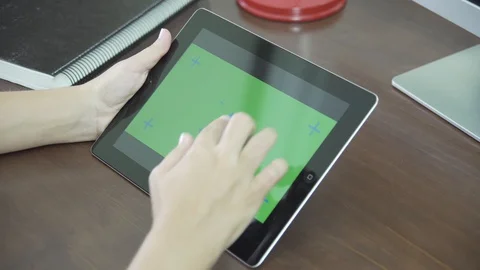 Woman using Tablet with Green Screen at Work Vídeos de archivo 129854064