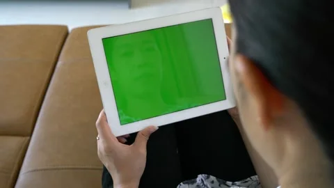 Woman Using Tablet with Green Screen Effect Stock Footage 314636902
