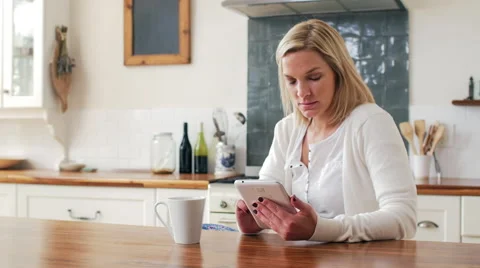 Woman using tablet at home Stock Footage 58280673