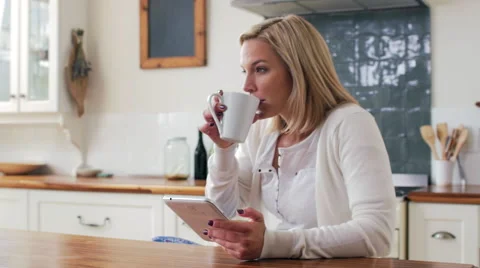 Woman using tablet at home Stock Footage 58280680