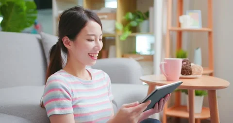 Woman using tablet at home Stock Footage 160254664