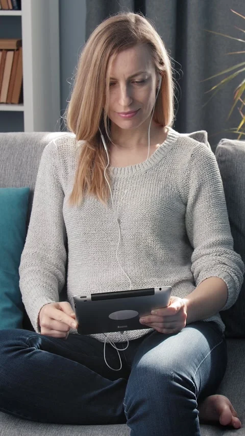 Woman Using Tablet at Home Stock Footage 322790047