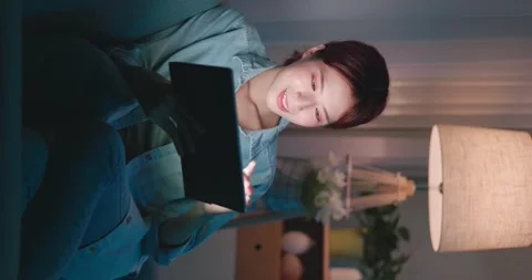 Woman using tablet at night Stock Footage 157137506