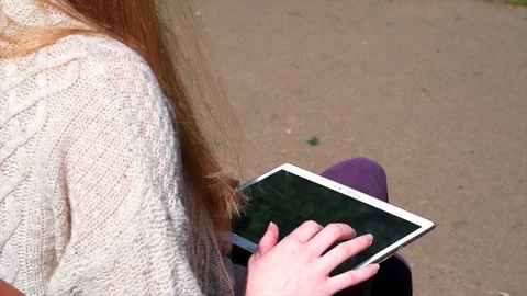 Woman Using Tablet In Park Stock Footage 90736283