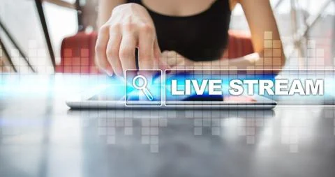 Woman using tablet pc and selecting live stream. Foto stock