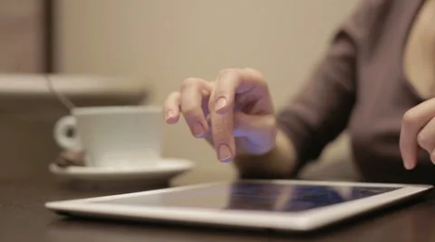 Woman using tablet pc in the cafe Video stock 48998942