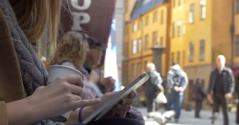 Woman using tablet PC in city street Video stock 57196692