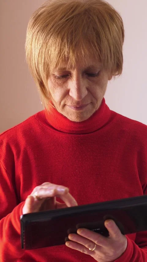 Woman using a tablet PC. Modern gadget in hand Stock Footage 302493892