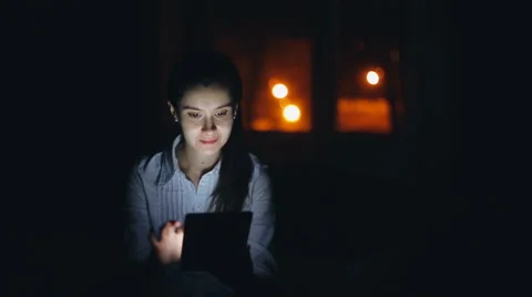 Woman using tablet pc at night Stock Footage 60161841