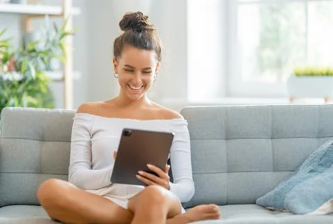 Woman is using tablet pc Stock Photos