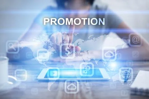 Woman using tablet pc, pressing on virtual screen and selecting promotion Fotos Stock