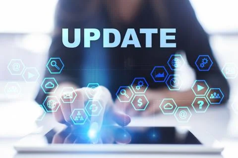 Woman is using tablet pc, pressing on virtual screen and selecting update Фото