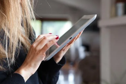 Woman using tablet Stock Photos