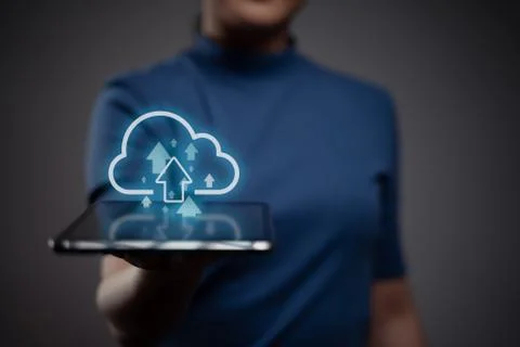 Woman using tablet for upload. Stock Photos