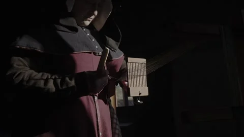 Woman using tablet weaving loom in a 15th Century household #2 Stock Footage 320257716