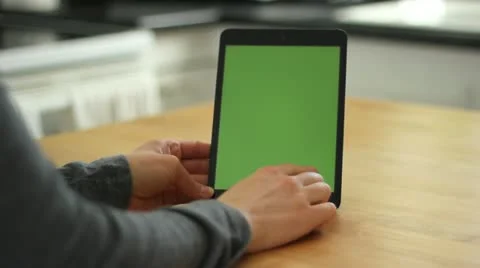 Woman Using Tablet on Wood Table With Various Hand Gestures - Green Screen Stock Footage 22219334