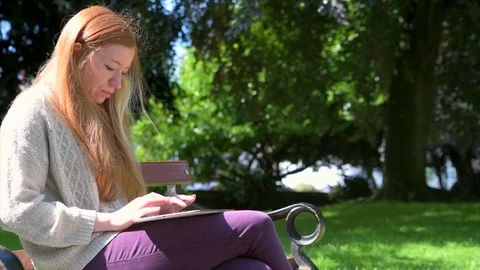 Woman Using Technology In Park Stock Footage 90740121