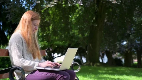 Woman Using Technology In Park Stock Footage 90743506