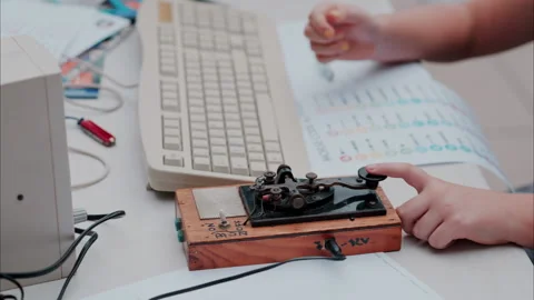 Woman using a telegraph device with a decipher Stock Footage 290023733