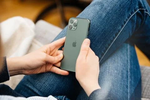 Woman using testing Apple Computers iPhone 11 Pro Foto stock