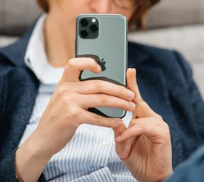 Woman using testing Apple Computers iPhone 11 Pro Foto stock