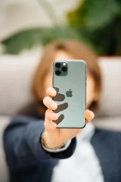 Woman using testing Apple Computers iPhone 11 Pro Foto stock