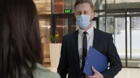 Woman using thermometer check temperature of office worker Stock Footage 150959963