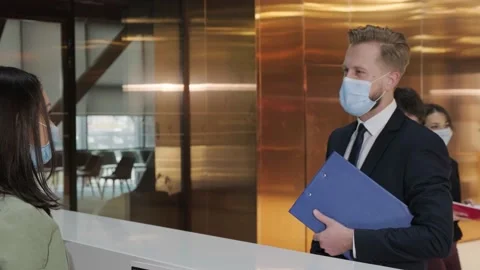 Woman using thermometer check temperature of office worker Video stock 153108927
