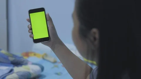 Woman using touch holding Smartphone with green screen, Doing Swiping. Woman  Stock Footage 116706010