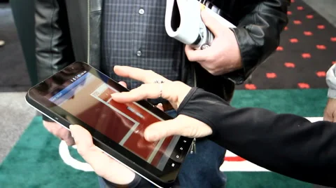 Woman using a touch screen tablet in the public Stock Footage 1094256