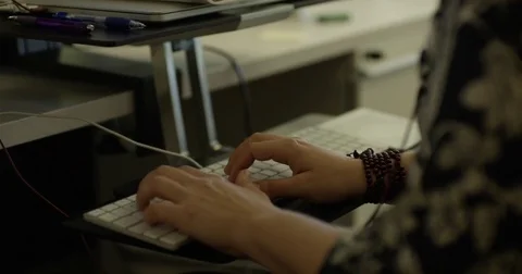 Woman Using Touchpad and Typing on Keyboard Stock Footage 79434507