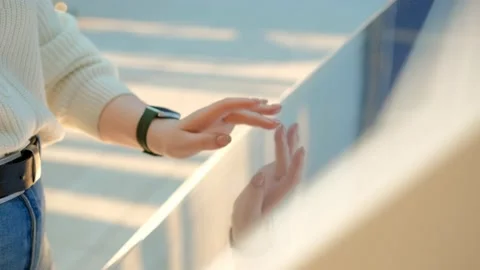 Woman using touchscreen terminal in mall. Detail view outstretched female hand Stock Footage 234536190