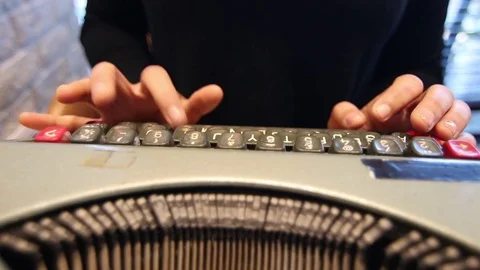 Woman using typing machine inside a cafe Stock Footage 72275957