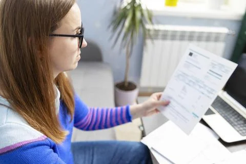 Woman using using calculator for calculate home finances or car taxes, woman  Stock Photos