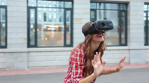 Woman using a virtual reality device Stock Footage 66077692