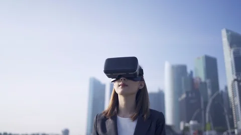  Woman using virtual reality device while traveling in Singapore . Stock Footage 124383777