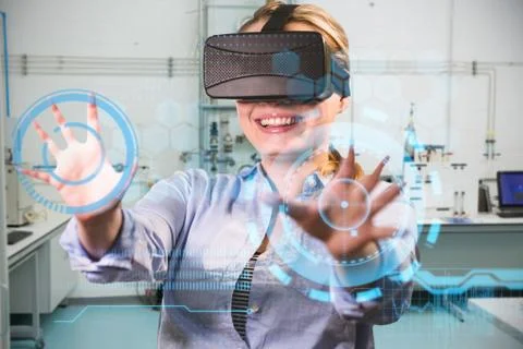 Woman using a virtual reality device against workshop Stock Photos