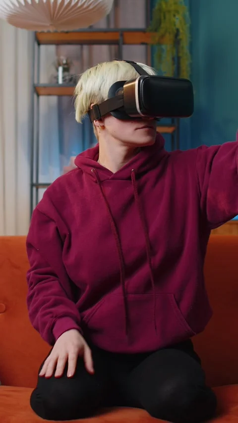Woman using virtual reality futuristic technology headset to play simulation 3D Stock Footage 347055506