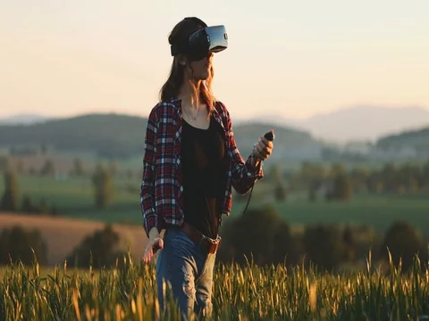 Woman Using Virtual Reality Glasses Outdoors. SLOW MOTION 4K. Stock Footage 77816837