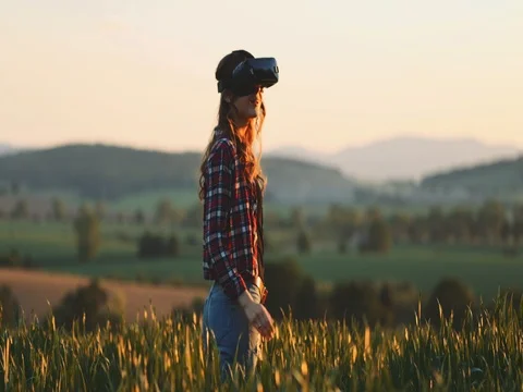 Woman Using Virtual Reality Glasses Outdoors. SLOW MOTION 4K. Stock Footage 77817421