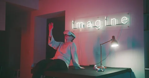 A woman using virtual reality glasses in her studio Stock Footage 201131007