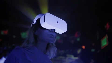 Woman using virtual reality headset at interactive technology exhibition Stock Footage 229698950