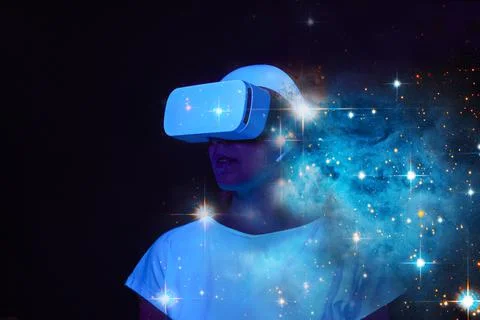 Woman is using virtual reality headset. Elements of this image furnished by NASA Stock Photos