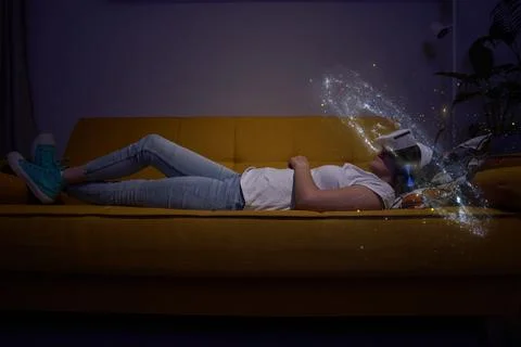 Woman is using virtual reality headset. Elements of this image furnished by NASA Stock Photos