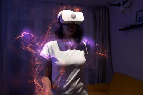 Woman is using virtual reality headset. Elements of this image furnished by NASA Stock Photos