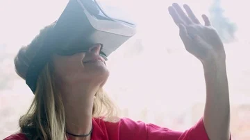 Woman using VR glasses Stock Footage 85594905
