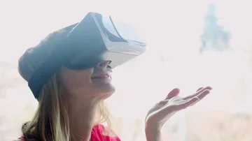 Woman using VR glasses Stock Footage 85594919