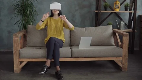 Woman is using a vr head-mounted display Stock Footage 74952349