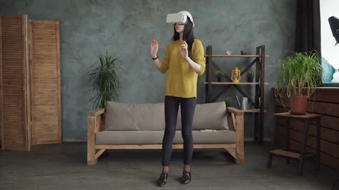 Woman is using a vr head-mounted display Stock Footage 74959037